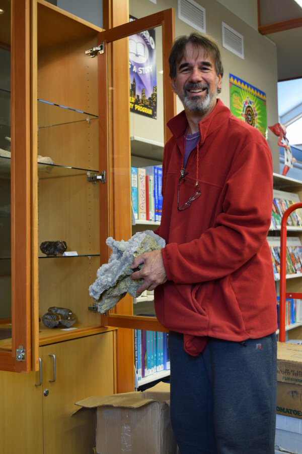 Scott installs a mineral display at his local county library.